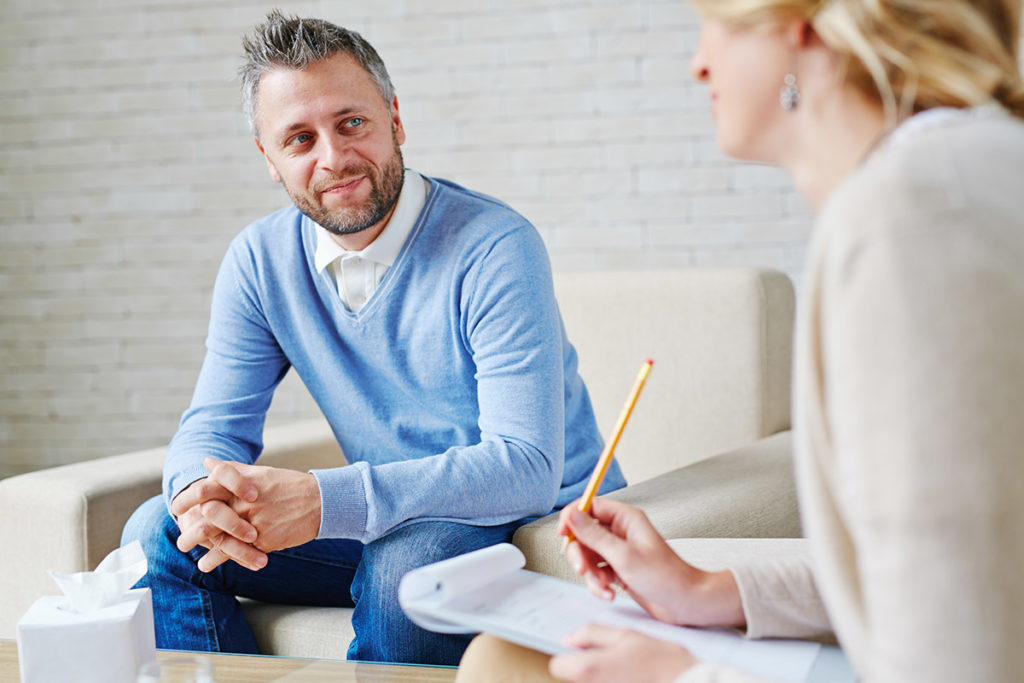 man benefiting from individualized care during therapy