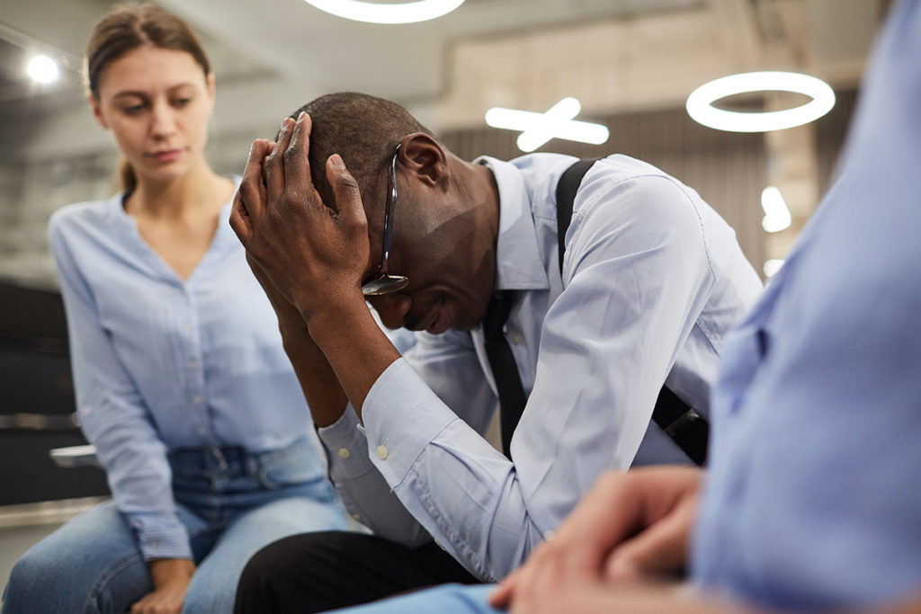 man holding his head asking experts Do I Need Dual Diagnosis Treatment