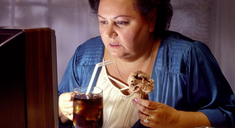women watching television and eating