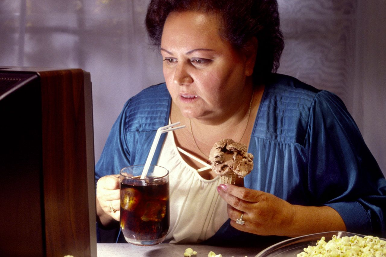 women watching television and eating