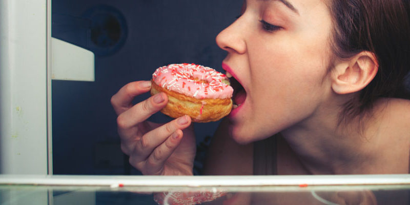 girl eating a donut