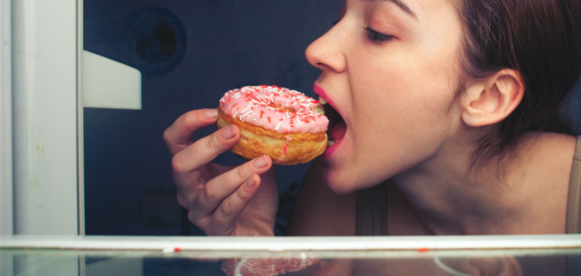 girl eating a donut