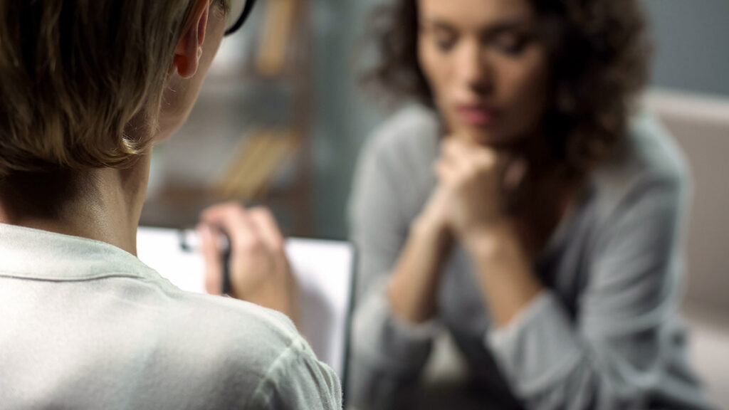 Woman in counseling wondering if there is a cure for bipolar disorder