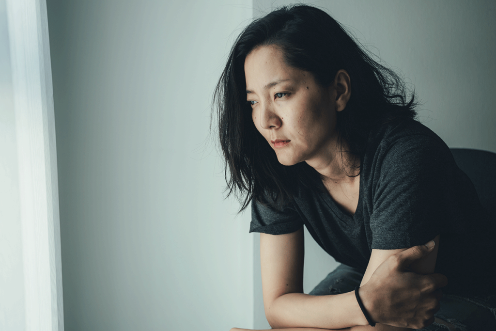 A woman thinking about cyclothymia disorder