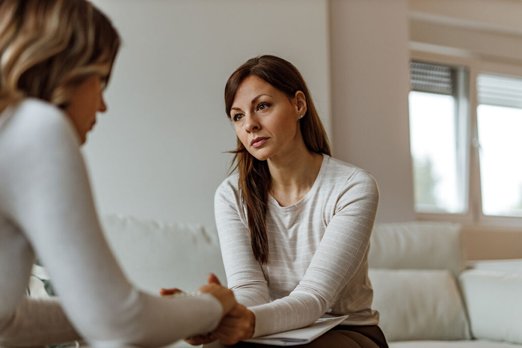 Woman discusses sex addiction treatment for women with a counselor
