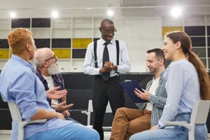 therapy group meets at a chronic relapse treatment center