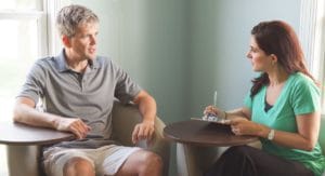 male client learning about his new cognitive behavioral therapy program