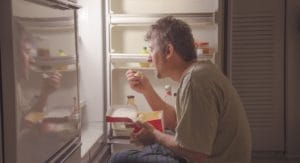 man struggles with food before seeking an osfed treatment center