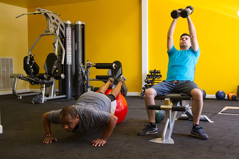 Men exercising in the gym rehab center photo gallery