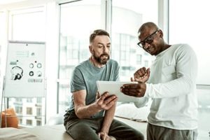 a doctor talking to a patient about an opioid addiction treatment center