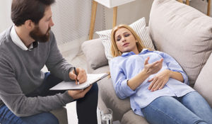 east coast addiction treatment center, woman on couch talking with therapist
