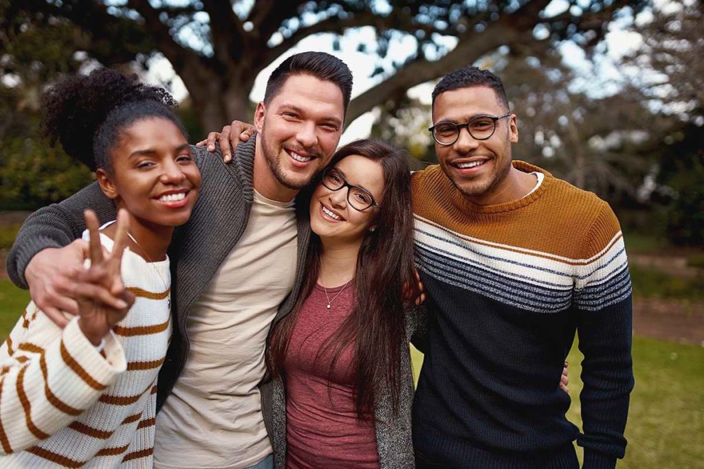 group of friends outside inpatient vs outpatient treatment