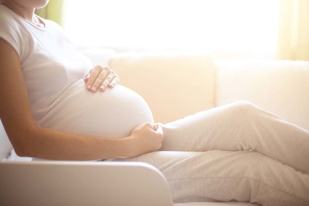 pregnant woman sitting wondering is alcoholism hereditary