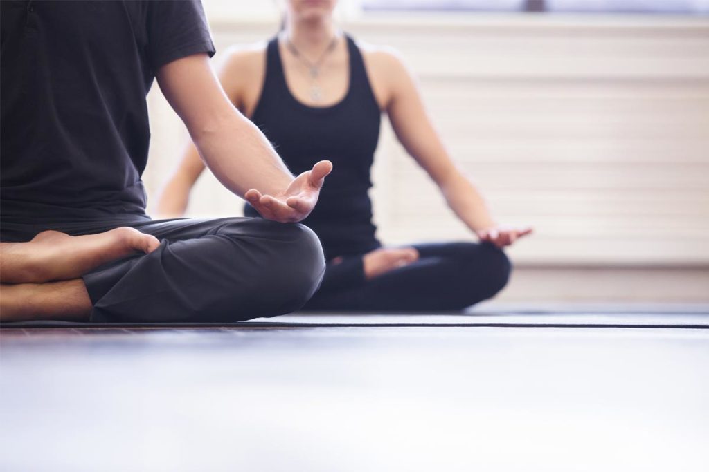 woman practicing yoga because yoga helps depression addiction