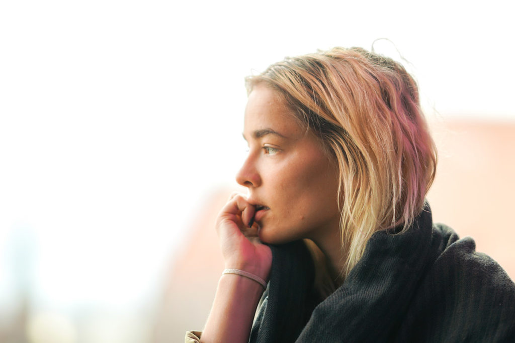 young woman biting nails wondering what is lean drug