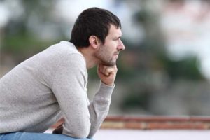 man thinking about a mood disorder treatment center