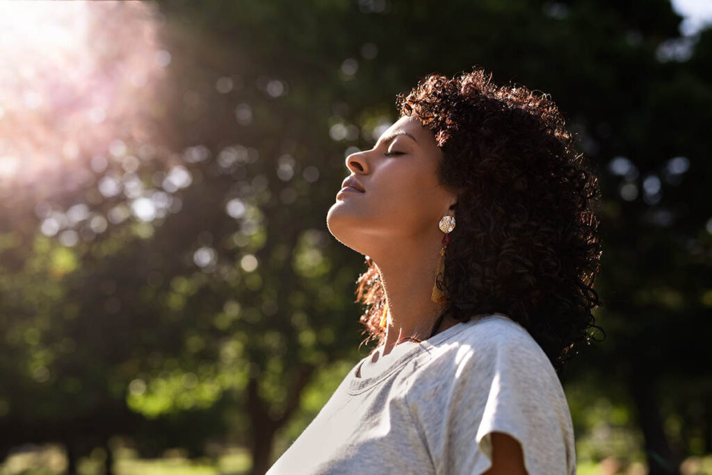 Woman meditating to fight depression symptoms naturally