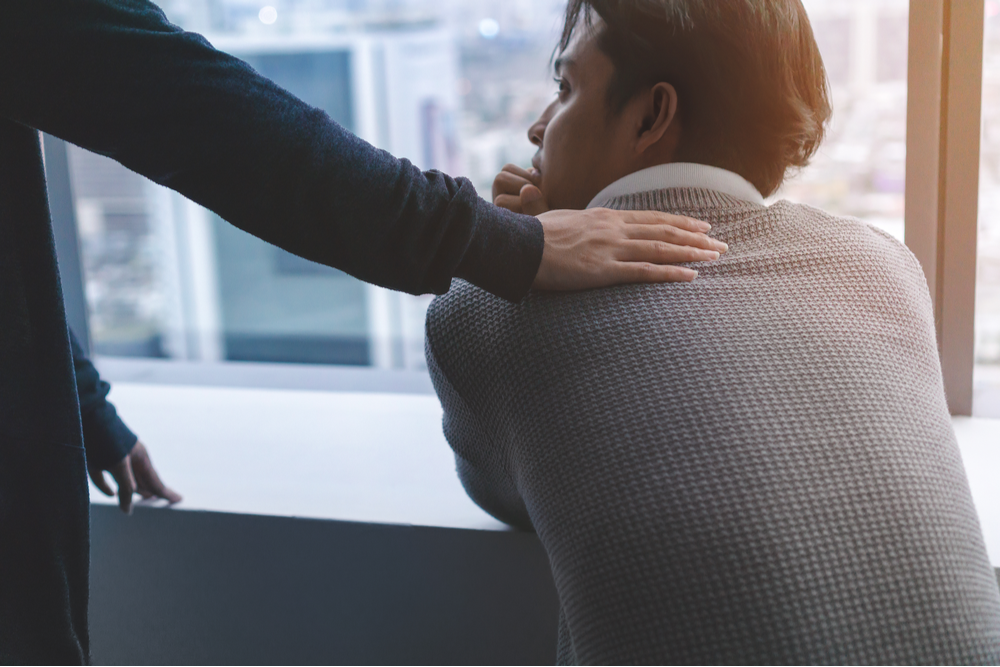 Man being comforted in person-first treatment