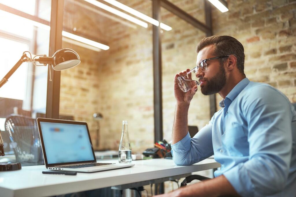 a person has a drink while at work possibly because they are a functioning alcoholic