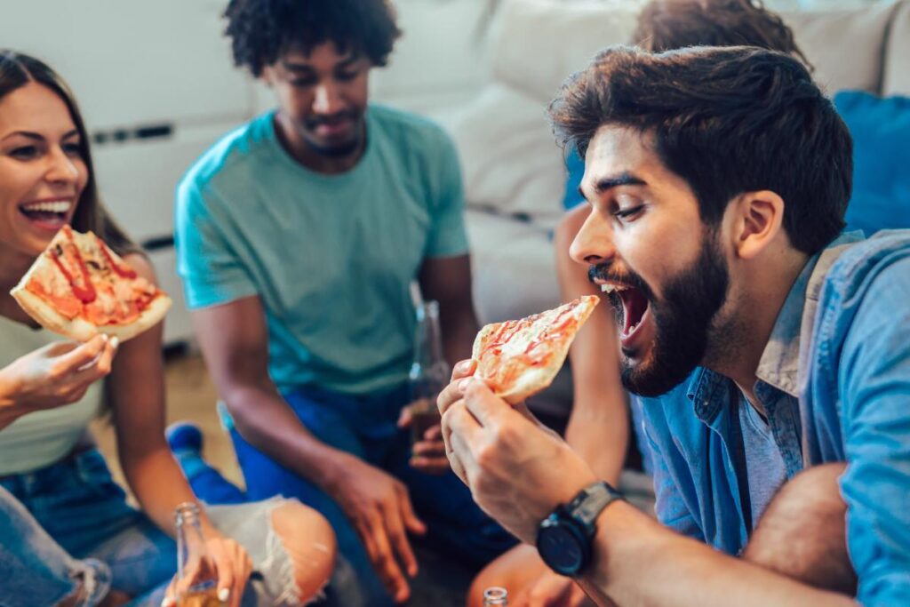 people eating pizza after finding out answers to the question does marijuana make you hungry