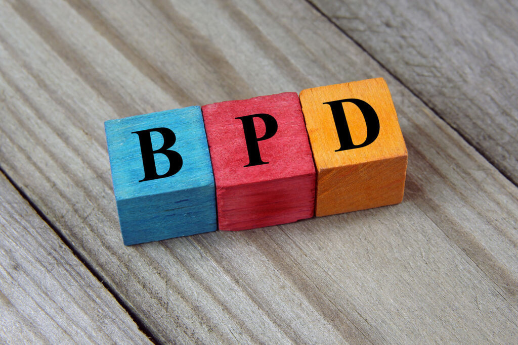 colorful blocks spelling out bpd as concept for what are the symptoms of bpd in men