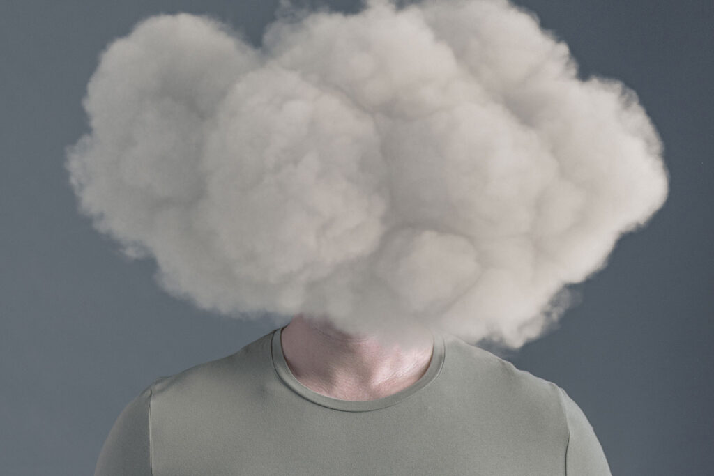 person with cloud over head experiencing brain fog after drinking