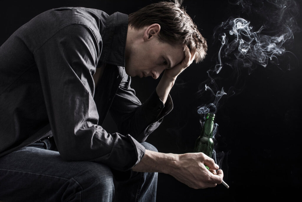 person smoking in dark place while wondering what is crossfading