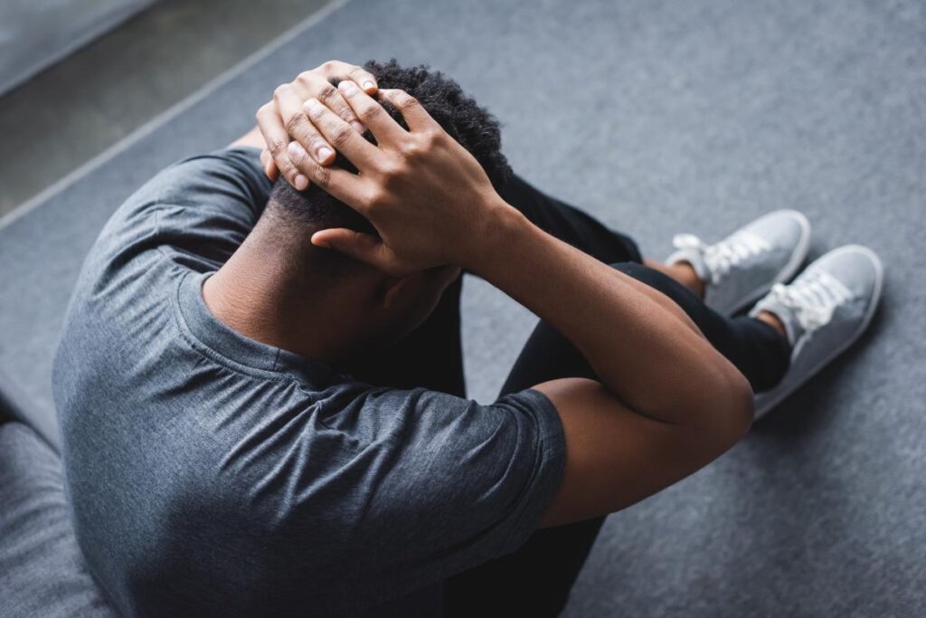person struggling with symptoms and wondering about panic attack vs anxiety attack