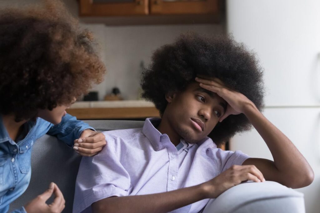 distressed person and concerned family member discussing the types of bipolar disorder