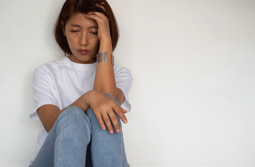 a woman struggles to conceal the signs of drug abuse