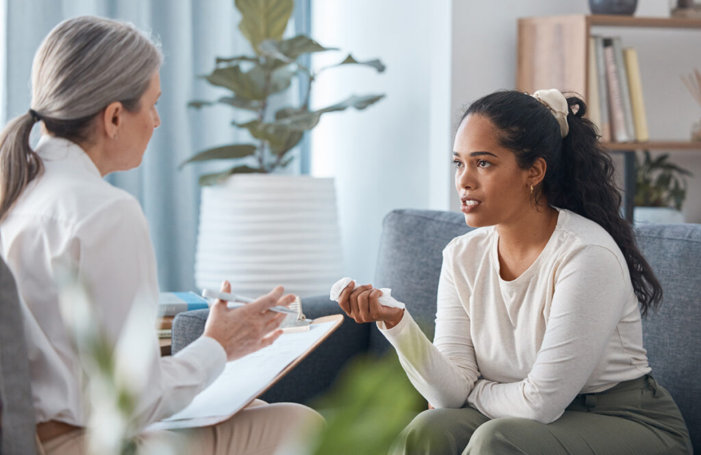 A woman inquiring about healthy coping mechanisms