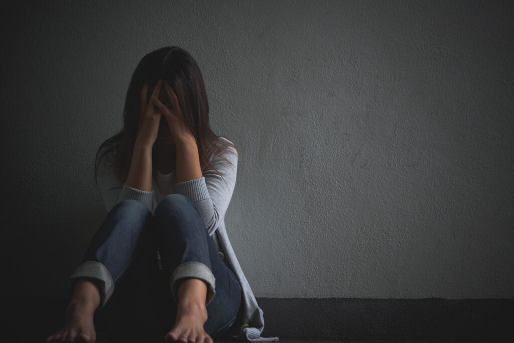 A woman wondering, "Is cocaine a stimulant?"
