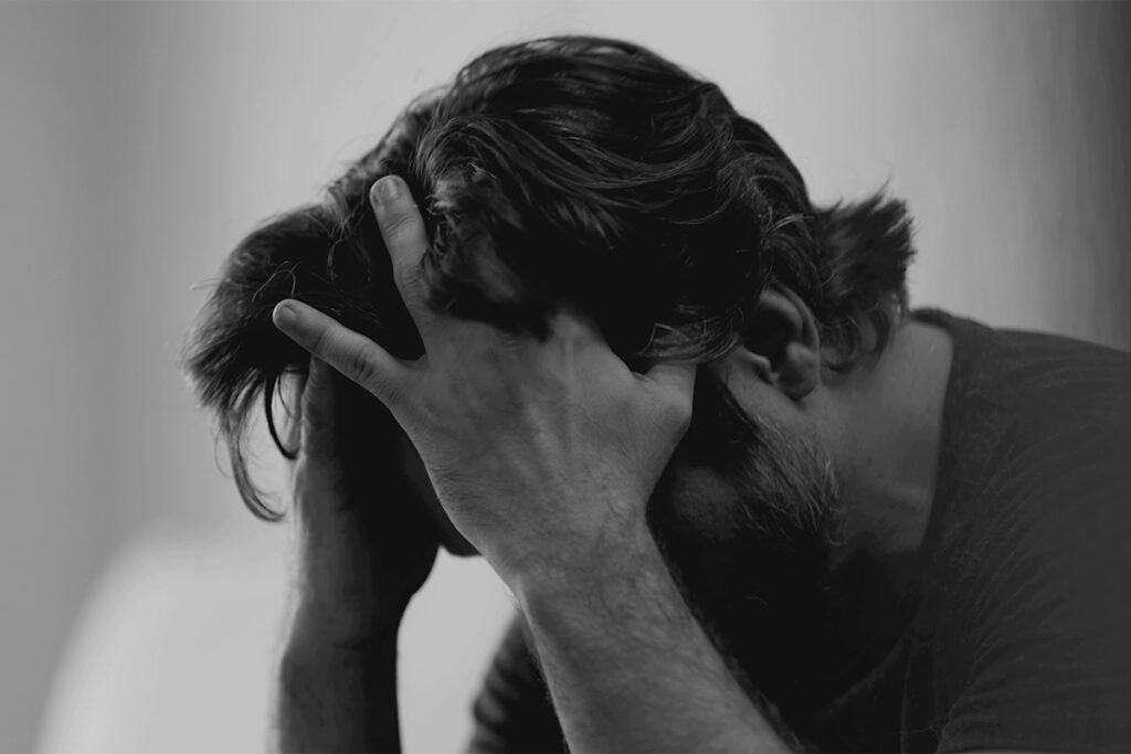 A man wondering, "Is heroin a depressant?"