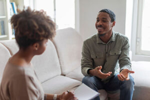 person in therapy after starting love addiction treatment