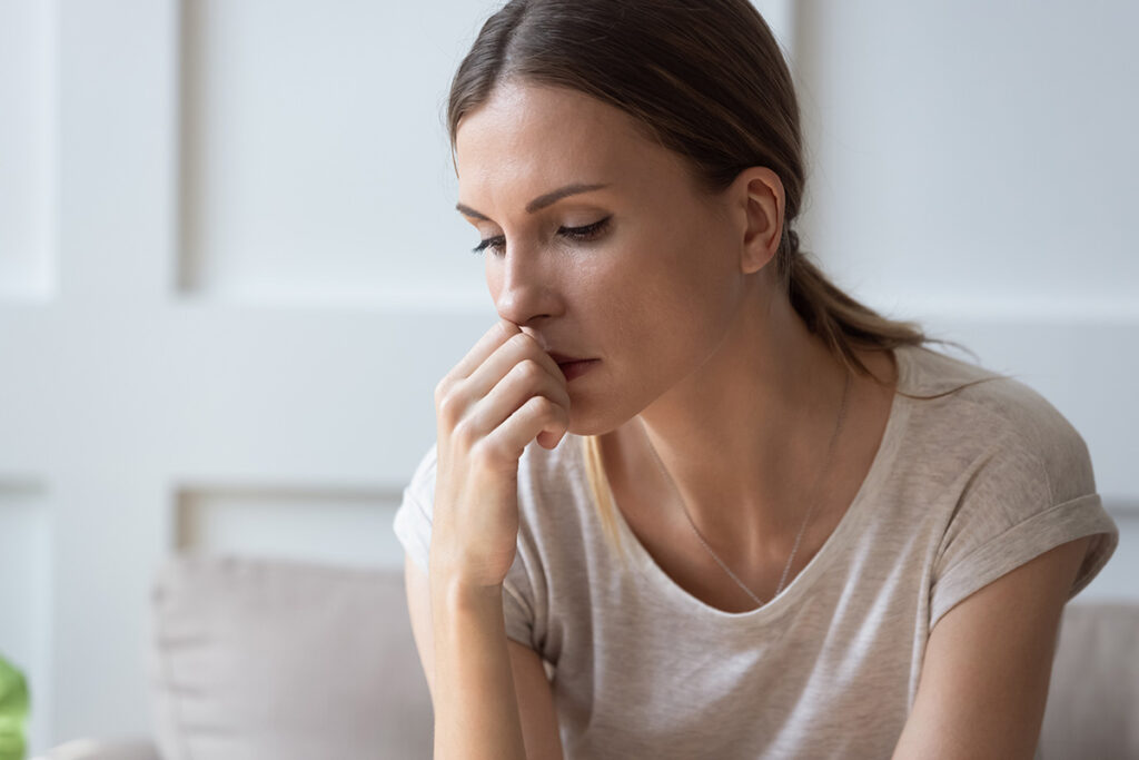 A woman thinking about OCD and anxiety.