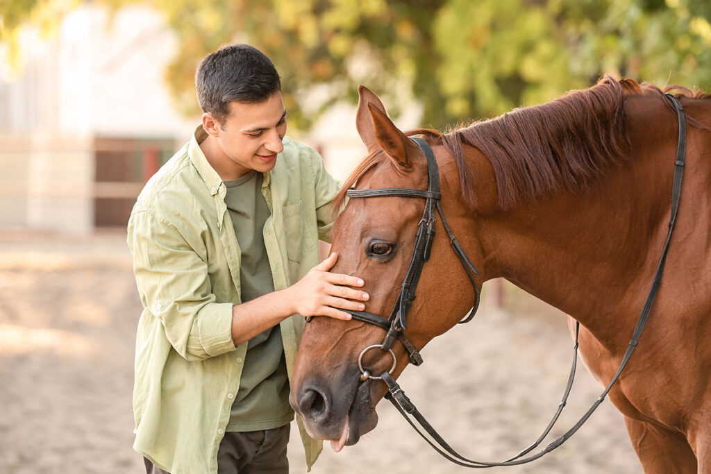 A man discovering equine therapy for mental health