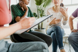 people in group therapy as part of rehab aftercare programs