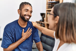Man being supported smiling